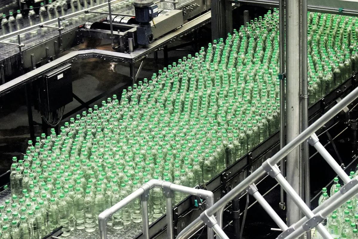 Bottles moving along a beverage production line